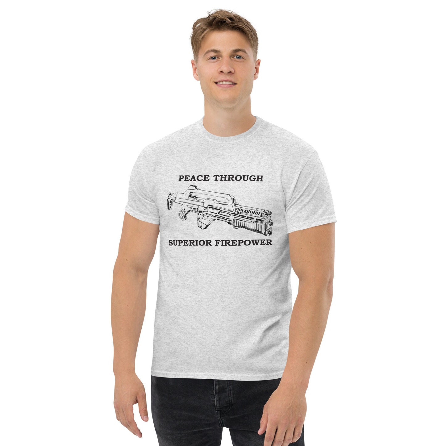 Front image of a very comfortable Alien Aliens Peace Through Superior Firepower shirt with high quality graphics to wear at your favorite convention