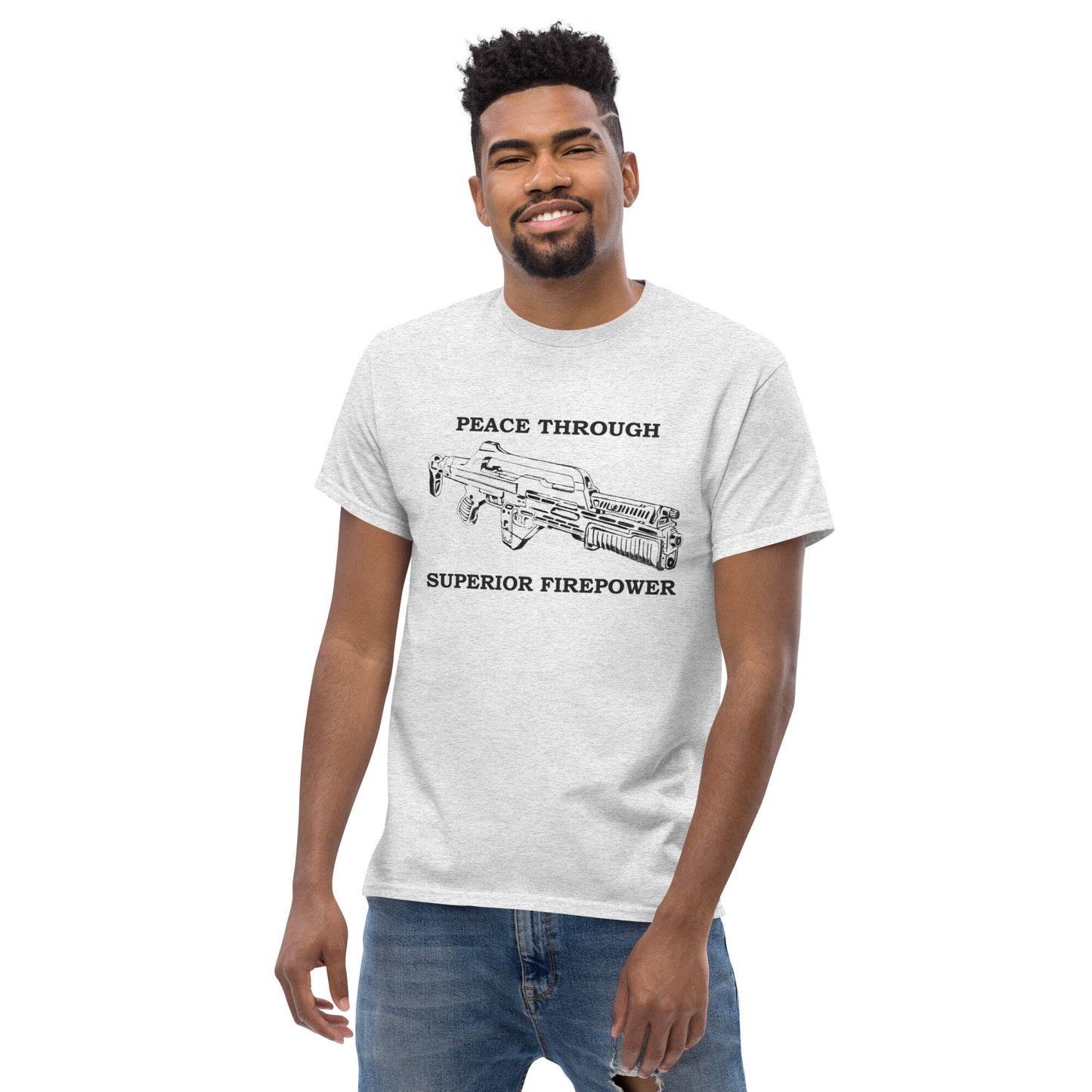 Front image of a very comfortable Alien Aliens Peace Through Superior Firepower shirt with high quality graphics to wear at your favorite convention